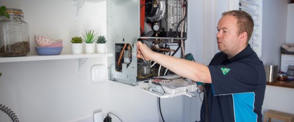 Engineer fixing boiler