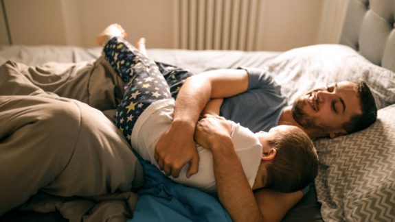 Father hugging child