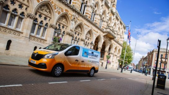 Custom Heat van driving through Northampton