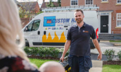 plumber walking down a driveway
